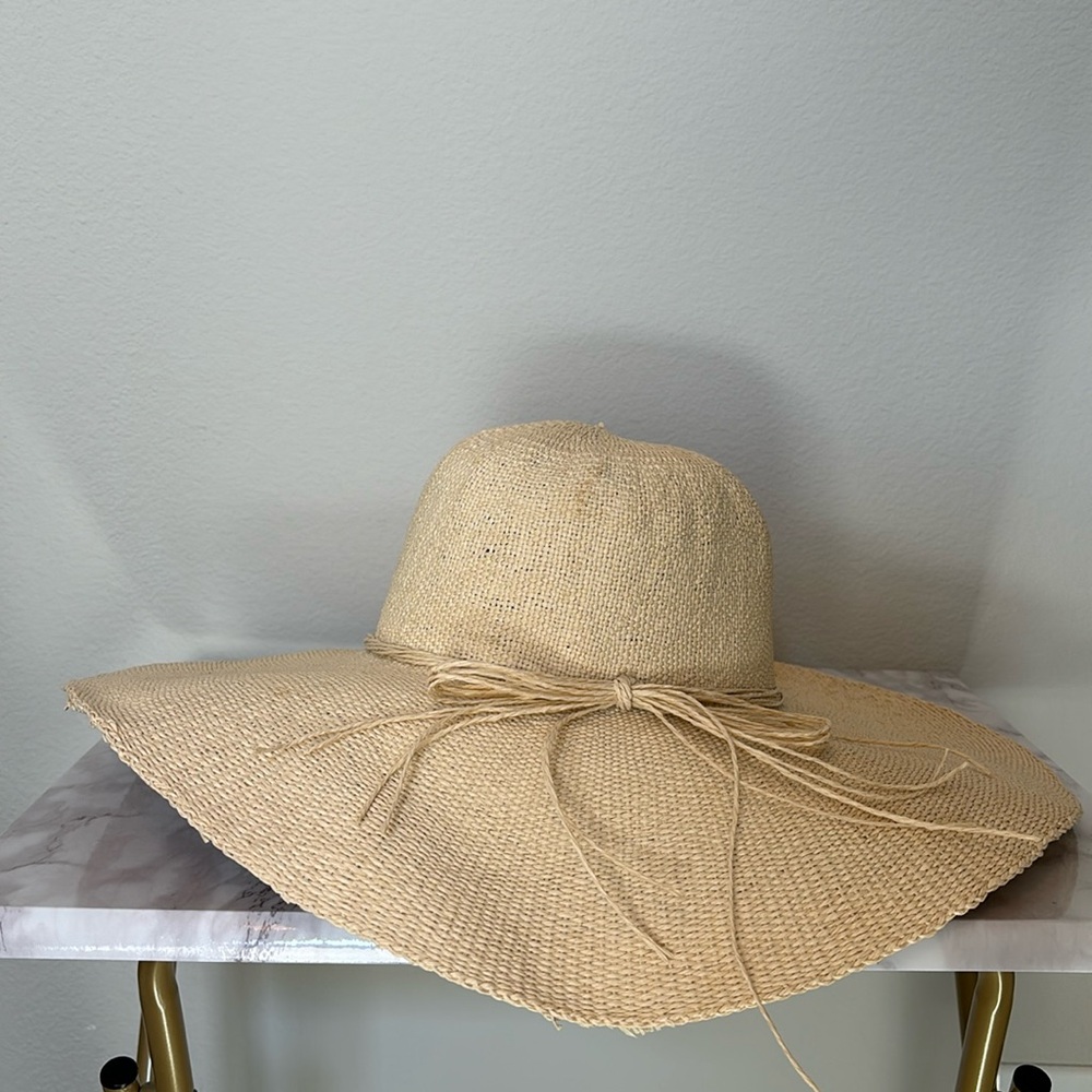 Floppy tan straw beach hat with straw bow